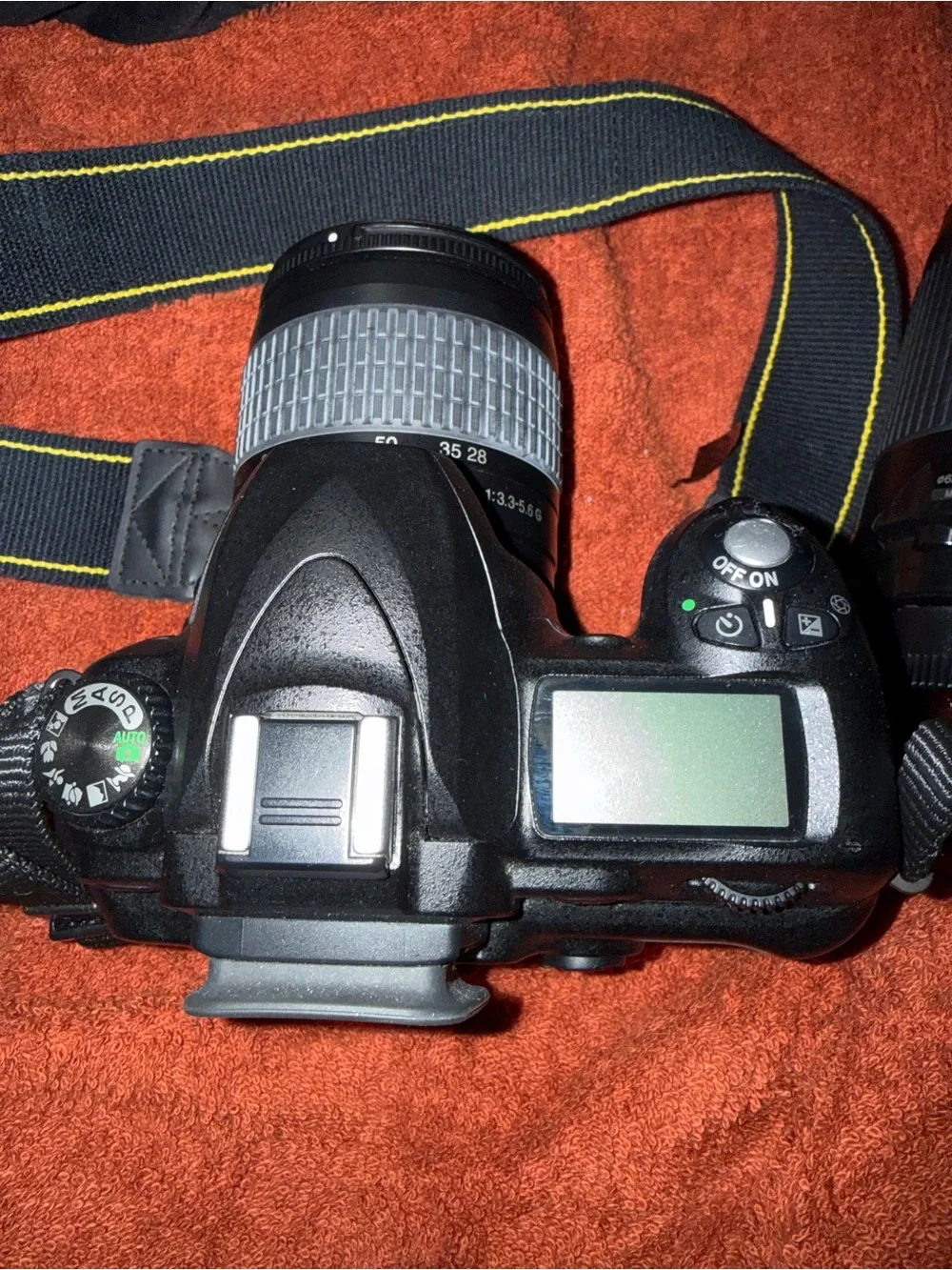 Nikon DSLR Camera Kit with Black Lowepro Bag and Yellow-Accented Strap